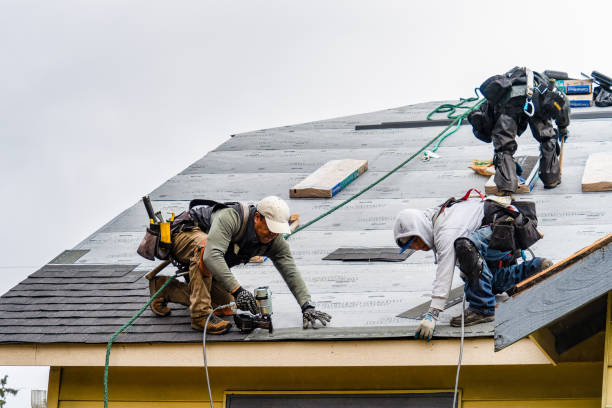 Professional Roofing technician working in Bloomington, CA